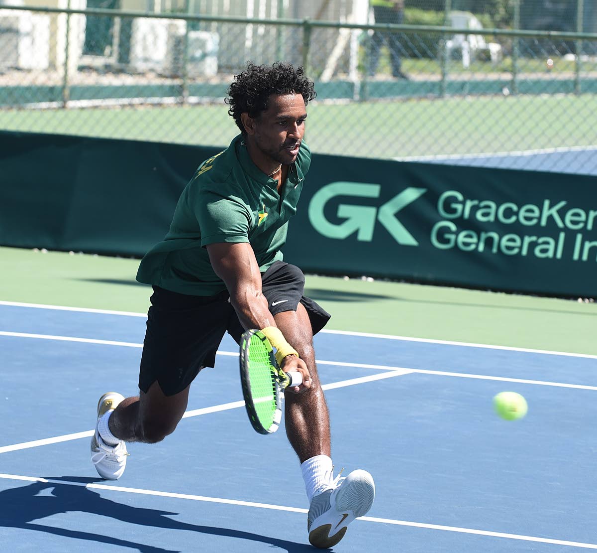 Jamaica's Rowland Phillips attempts to get to Uruguay's Franco Roncadelli's drop shot during their Davis Cup Group II singles match at the Liguanea Club in New Kingston yesterday.