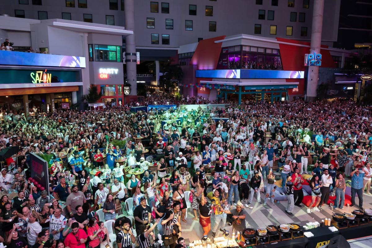 Fans in San Juan, Puerto Rico, watch Bad Bunny’s halftime show of the NFL Super Bowl 60 football game on television.