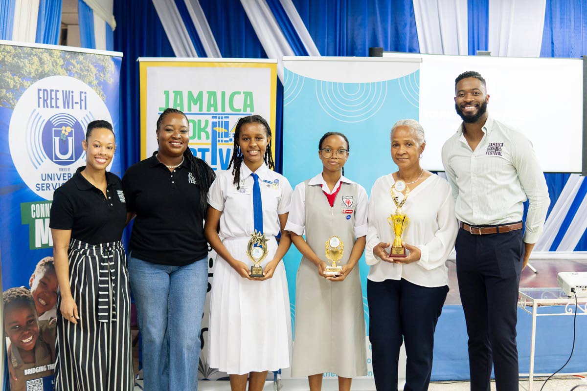 Jamaica Book Festival Director Latoya West-Blackwood (2nd left), along with members of the Jamaica Book Festival team - prize coordinator Stephanie Koathes (left) and marketing director Joel Nomdarkham (right), share a moment with poetry awardees (from lef