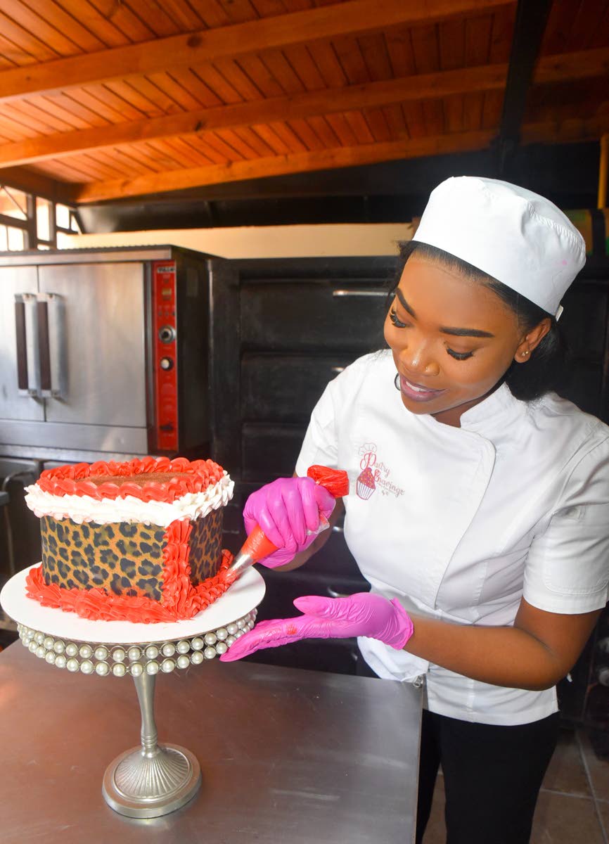 The pastry chef piping her heart-shaped vanilla and chocolate confection. She grew up making Christmas fruit cakes with her mother, Charmaine Flash, a fellow baking entrepreneur. 