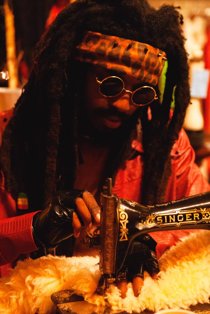 The multi-hyphenate creative also designs and makes his own outfits. 