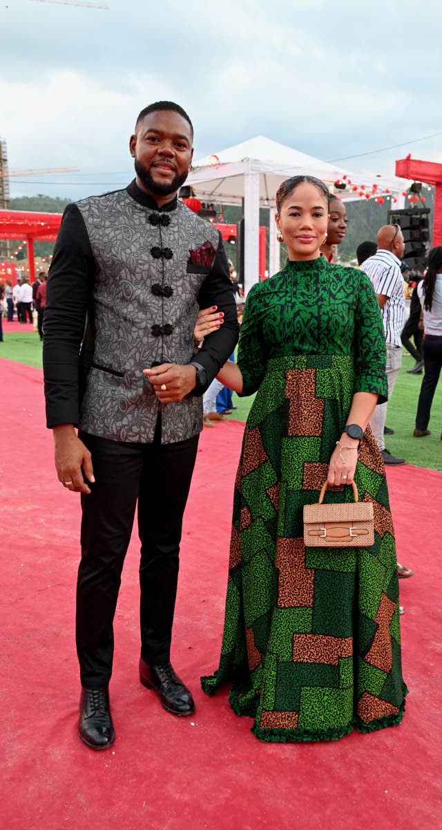Pairing up for a quick photo are Mayor of Montego Bay Richard Vernon and Stacey Silvera, embracing the theme in Asian-inspired designs.