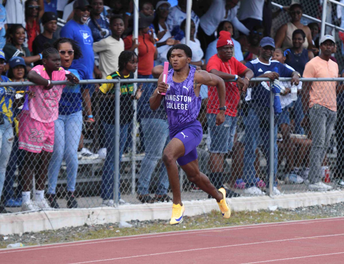 
Kingston College’s Kyle Bodden stretches his legs during the Class 1 4x100 metres at the Corporate Area Athletics Championships at the Ashenheim Stadium, Jamaica College yesterday.