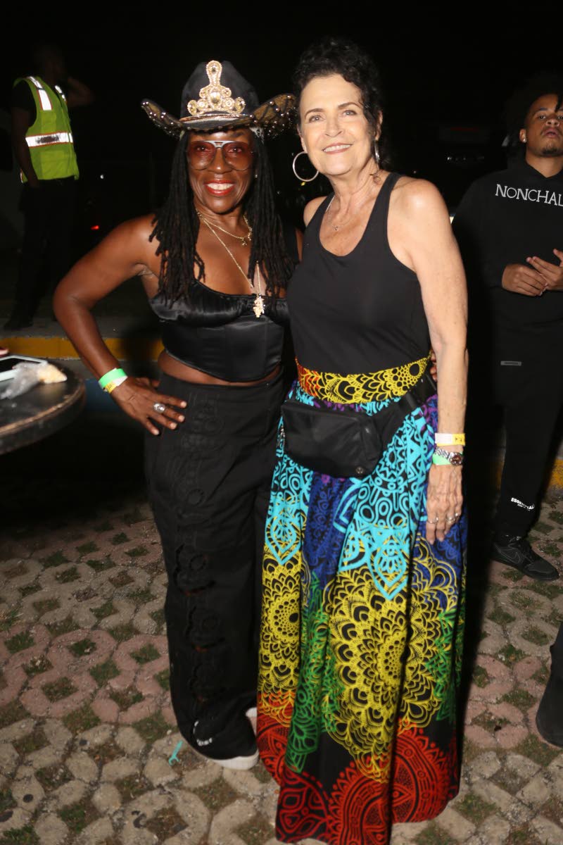 Nadine McNeil (left) and Cindy Breakspeare step out in relaxed bohemian style for the musical celebration.