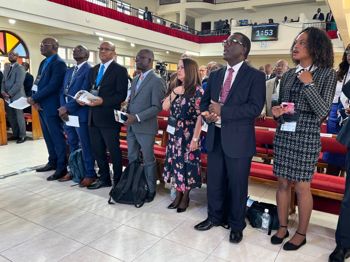 Gabrielle Morrison (right) sings the theme song with other local and regional leaders of the Seventh-day Adventist Church.