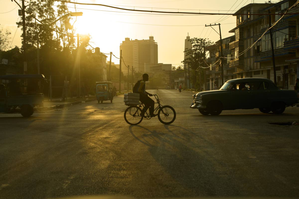 A man riding his bicycle at sunset in Havana last Wednesday.