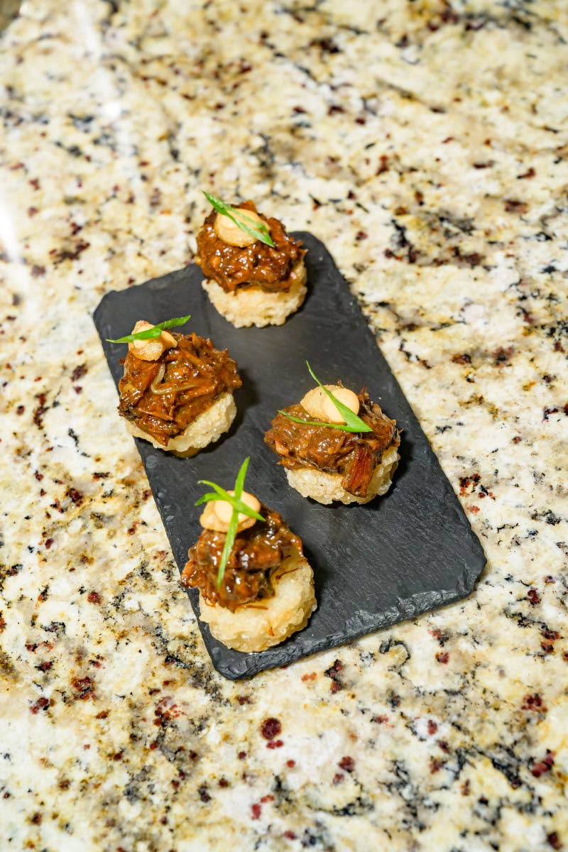 The oxtail crispy rice cake combined Guinness-braised oxtail with a crisp rice base and tempura-fried broad beans.