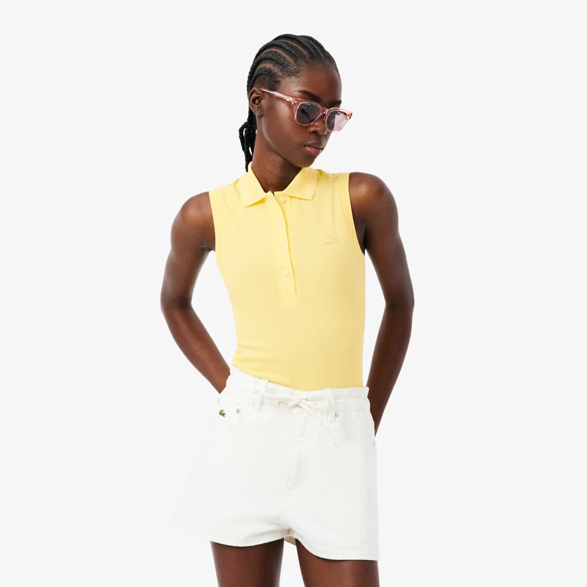 Monogram specs on, Tomiwa sports the Lacoste sleeveless stretch polo shirt and Bermuda shorts from the iconic French fashion company.
