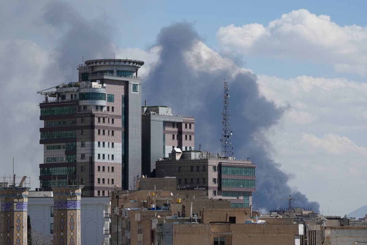 Smoke rises up after a strike in Tehran.