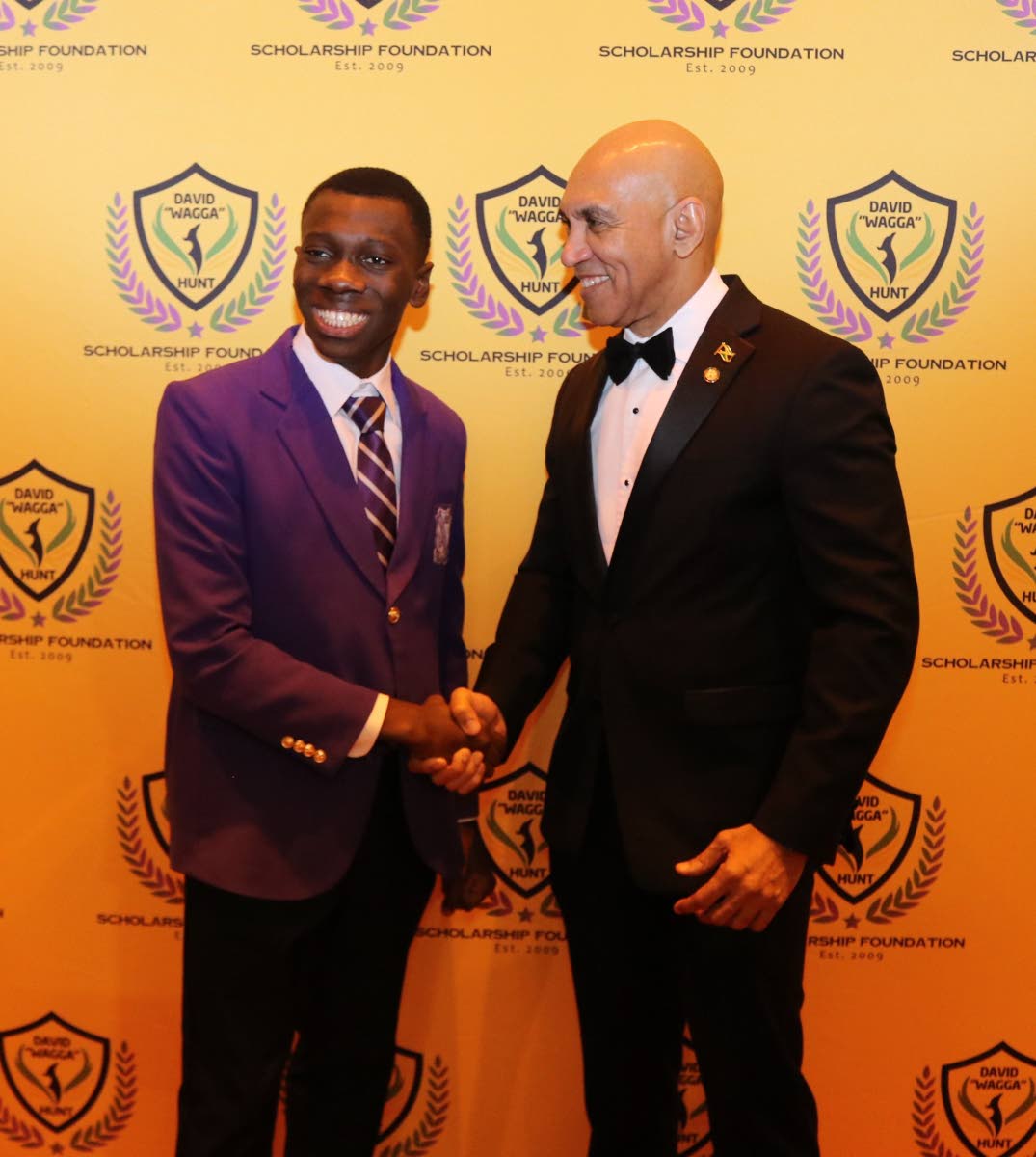 Jamaica’s Ambassador to the United States, His Excellency Major General (Ret’d) Antony Anderson congratulates Kingston College’s David Wagga Hunt 2025 scholarship recipient Khaliel Woodhouse at its 12th annual red-carpet gala at the National Educatio