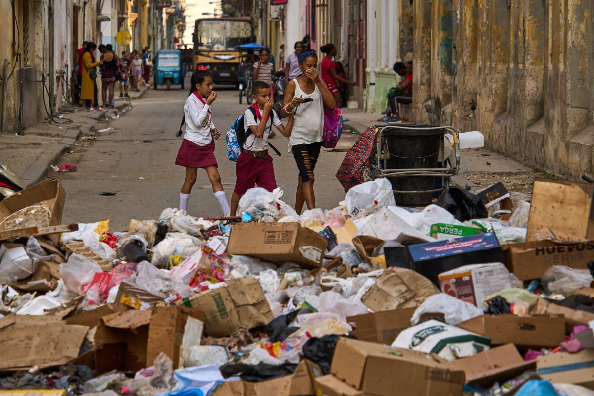 People wait to board transportation in Havana, Cuba on February 6, 2026. (AP Photo/Ramon Espinosa)