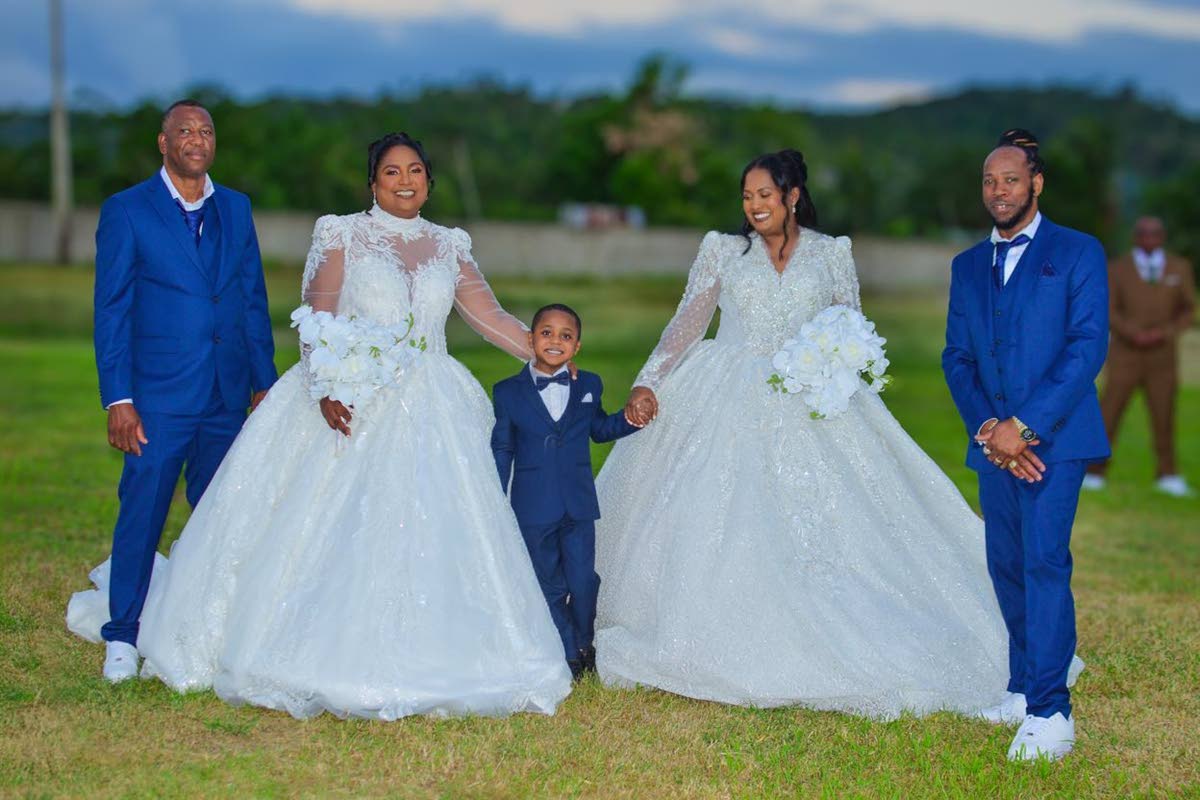 Ring bearer Romeish (centre) is joined by his parents, Henry (right) and Dianne Johnson (second right), and Gary (left) and Keisha Cooper (second left).