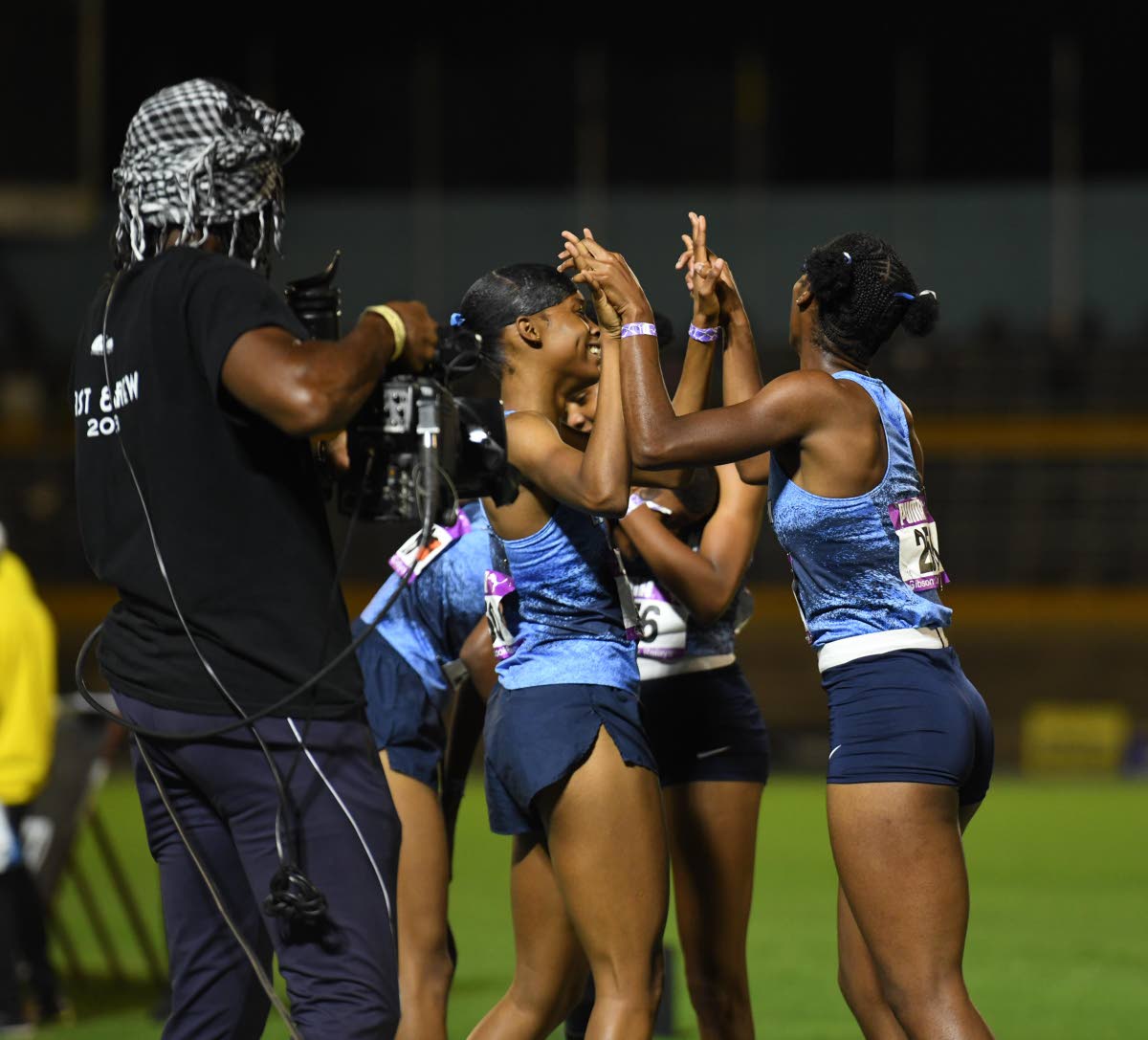 Edwin Allen’s quartet celebrates winning the 4x400-metre girls’ Open at the Gibson McCook Relays inside the National Stadium on Saturday. 