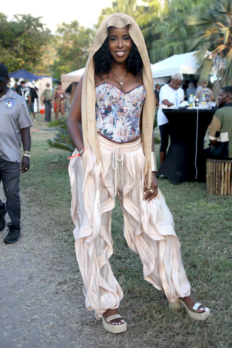 Zaneta Scott, music urbanism scholar, stuns in an eye-catching, flowy pants paired with a corset and head scarf.

