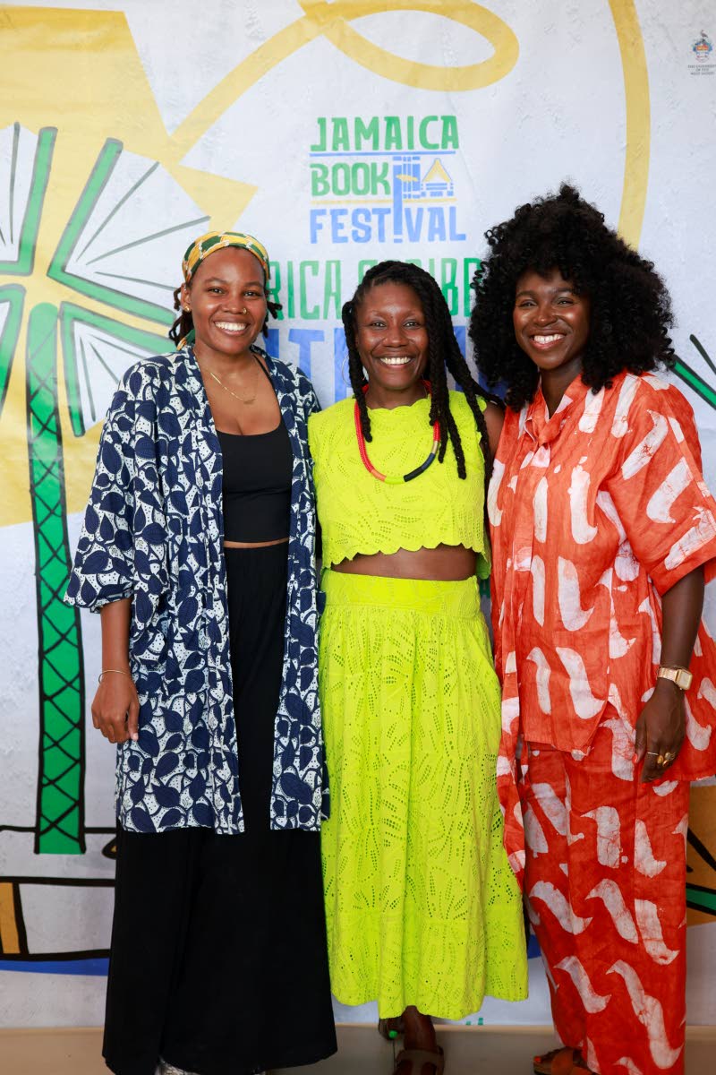 Nicole Dennis-Benn (centre), award-winning, bestselling author of ‘Here Comes the Sun’ and ‘Patsy’, who travelled to Jamaica as a featured speaker for the festival, shares a warm moment with Natasha Cunningham (left), visual artist and graphic desi