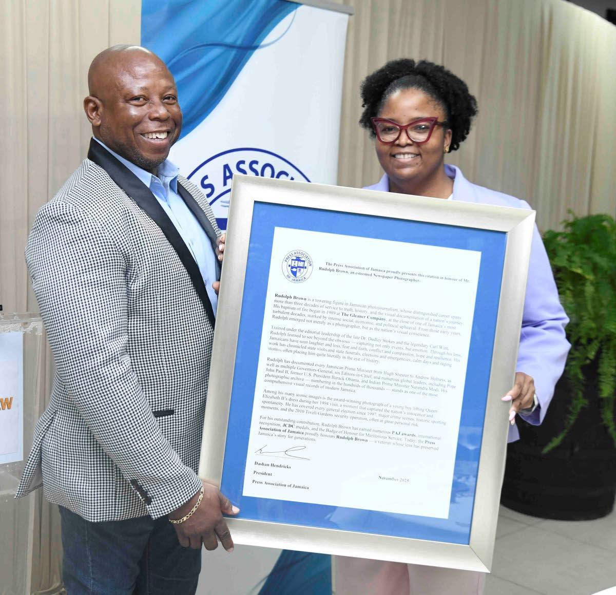 The Gleaner’s Rudolph Brown is presented with a citation in recognition of his 37 years of service to photojournalism at the Press Association of Jamaica’s veteran luncheon held on March 4, 2026 at J. Wray and Nephew’s office, Dominica Drive, New Kin