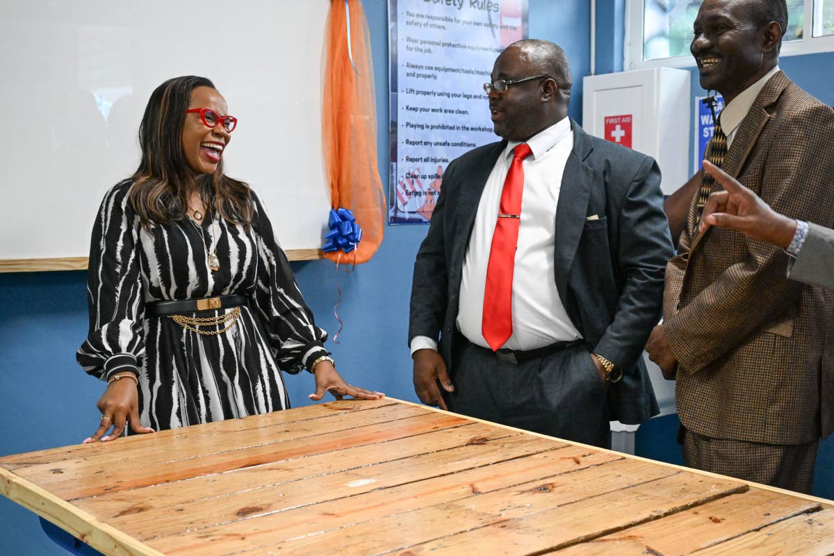 Permanent Secretary in the Ministry of Education, Skills, Youth and Information, Dr Kasan Troupe (left), shares a moment with Principal, St Mary Technical High School, Orville Richards (centre), and Board Chairman, St Mary Technical High School, Dr Isaac B