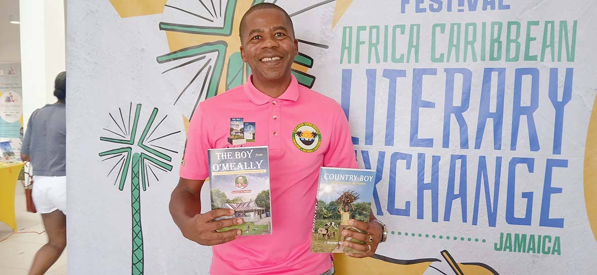 Everton G. Walker displaying his autobiographies, ‘Country Boy - The Omeally Memoirs’ and ‘The Boy from Omeally’.

