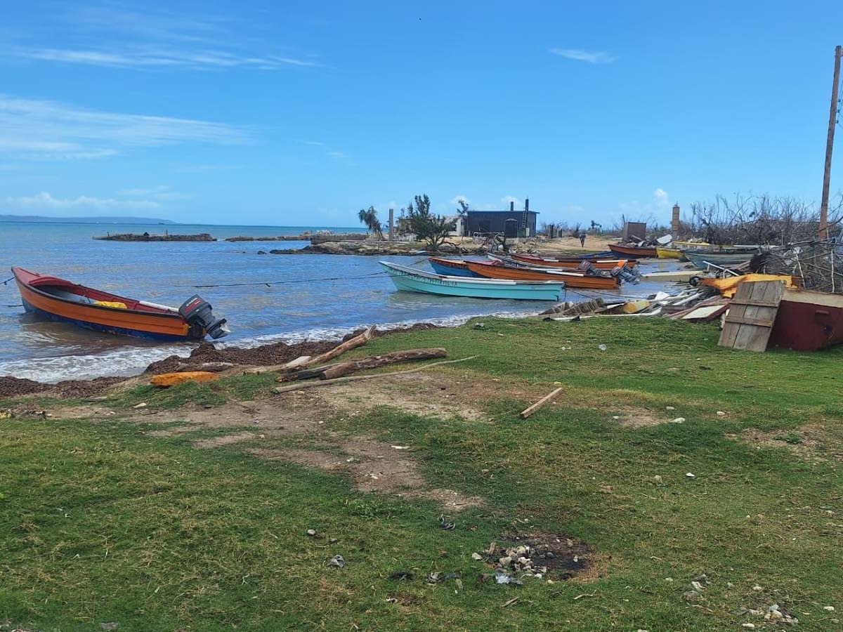 Fishing boats docked along the Galleon Beach, waiting to return to the sea as local fishers rebuild their livelihoods after Hurricane Melissa.