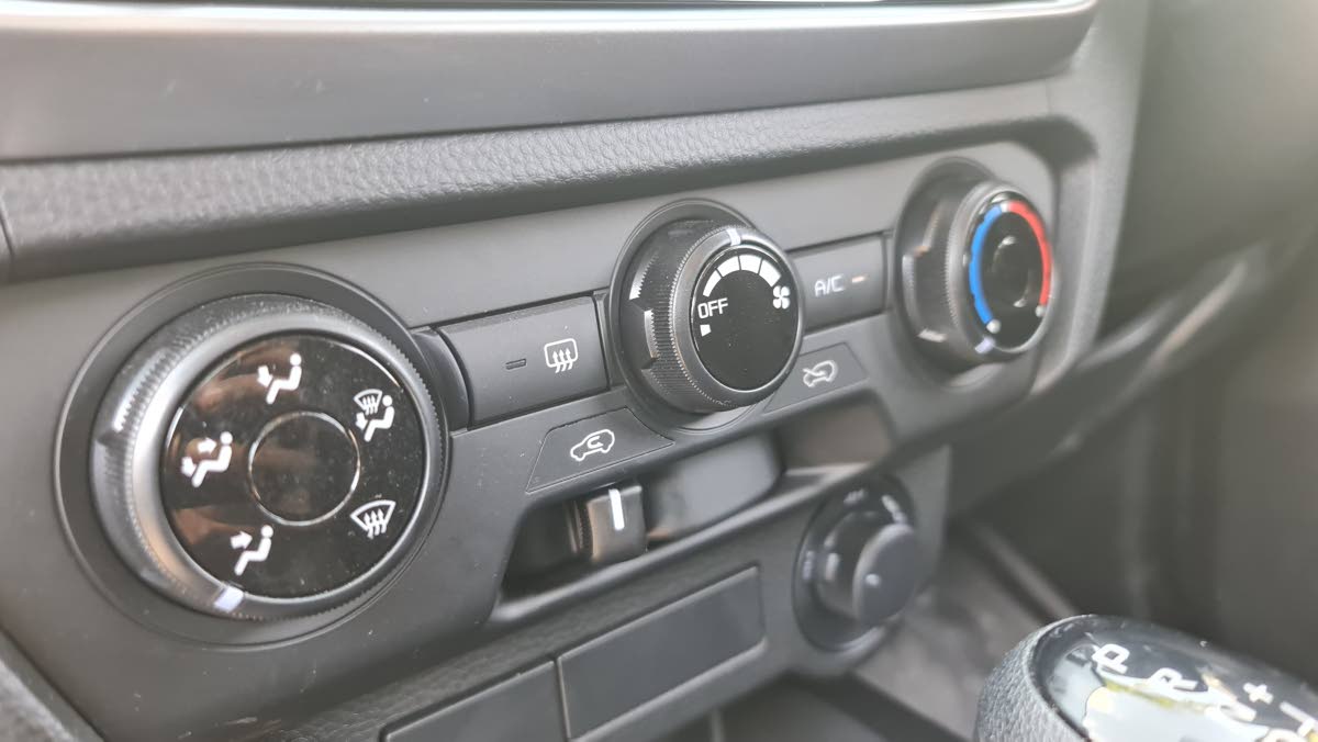 The instrument cluster features a clear, high-contrast temperature gauge alongside vital engine data, ensuring the 4JJ3 powerplant is operating within its optimal thermal range during heavy towing.