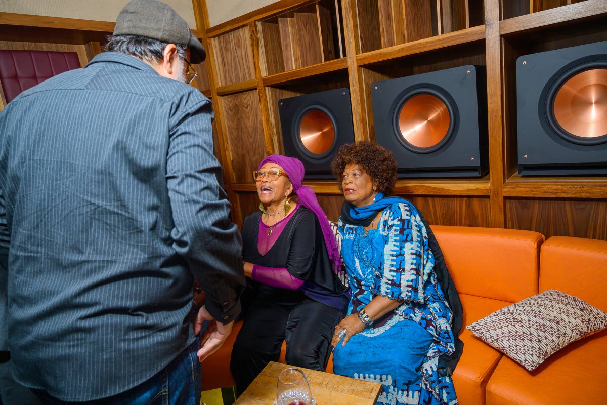 Reggae icons Marcia Griffiths and Judy Mowatt are greeted by Opposition Leader Mark Golding, member of parliament for St Andrew Southern.