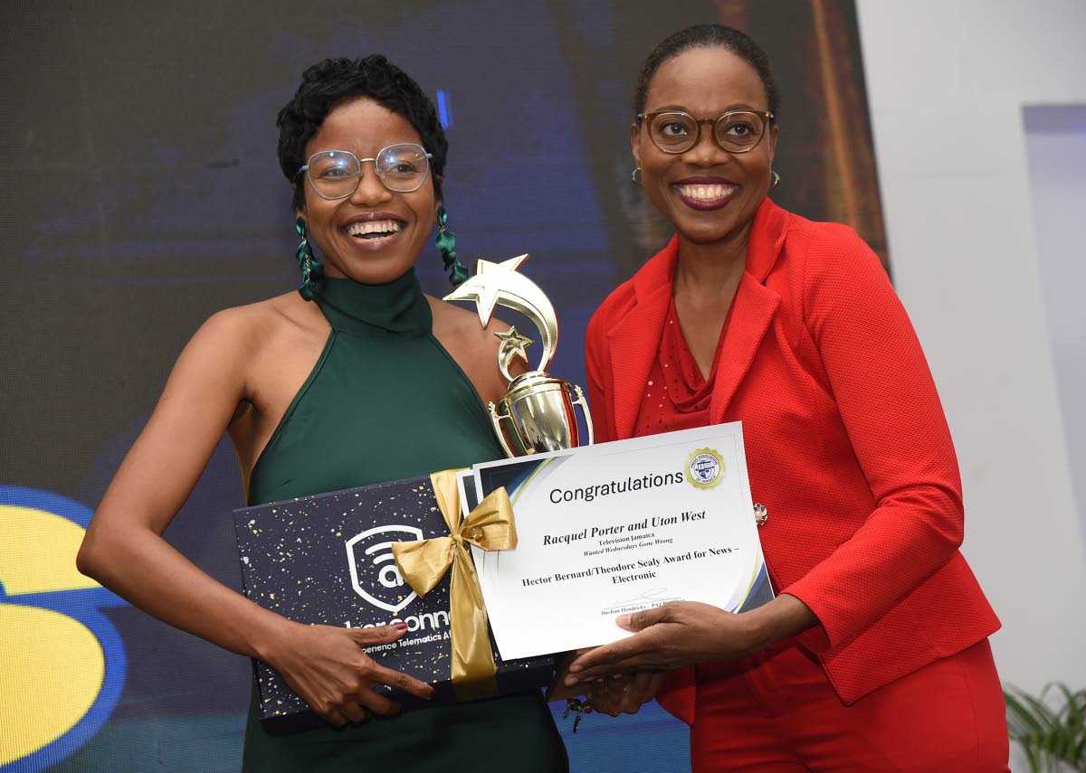 Racquel Porter (left) of Radio Jamaica receives the Hector Bernard/Theodore Sealy Award for News Journalism ( Electronic) from Audrey Williams, manager of public relations at the Jamaica Public Service.