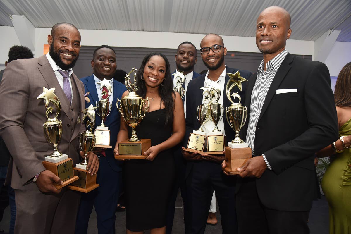 From left: The Gleaner’s Corey Robinson, Matthew McKoy, Kimone Francis, Antoine Lodge, Jovan Johnson, and Livern Barrett pose with their trophies after receiving awards at the National Journalism Awards held at the S Hotel on Saturday.
