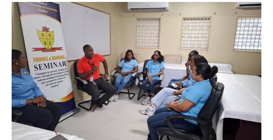 CEO Roan Grant speaks with members of the UTech Finance and Banking Seminar group during their visit to the Savanna-la-Mar Public General Hospital.
