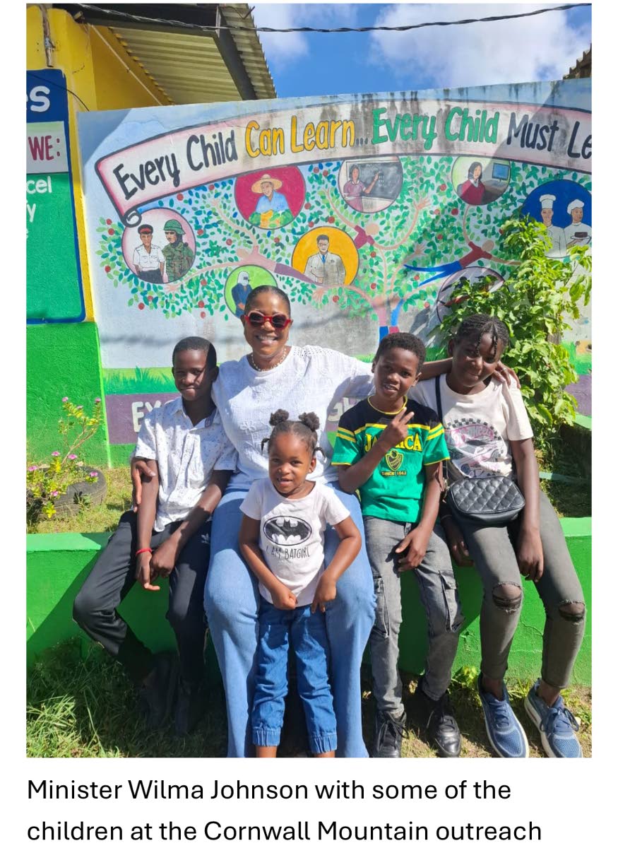 Minister Wilma Johnson with some of the children at the Cornwall Mountain outreach.