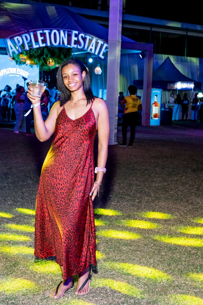 Dr Danielle Williams paired a wild animal print maxi with cutaway sandals. 