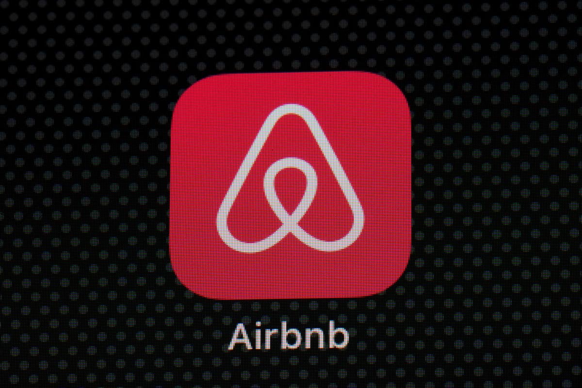 FILE - The Airbnb app icon is displayed on an iPad screen in Washington, D.C., on May 8, 2021. Airbnb says it’s banning the use of indoor security cameras in listings around the world by the end of next month. The San Francisco-based online rental platfo