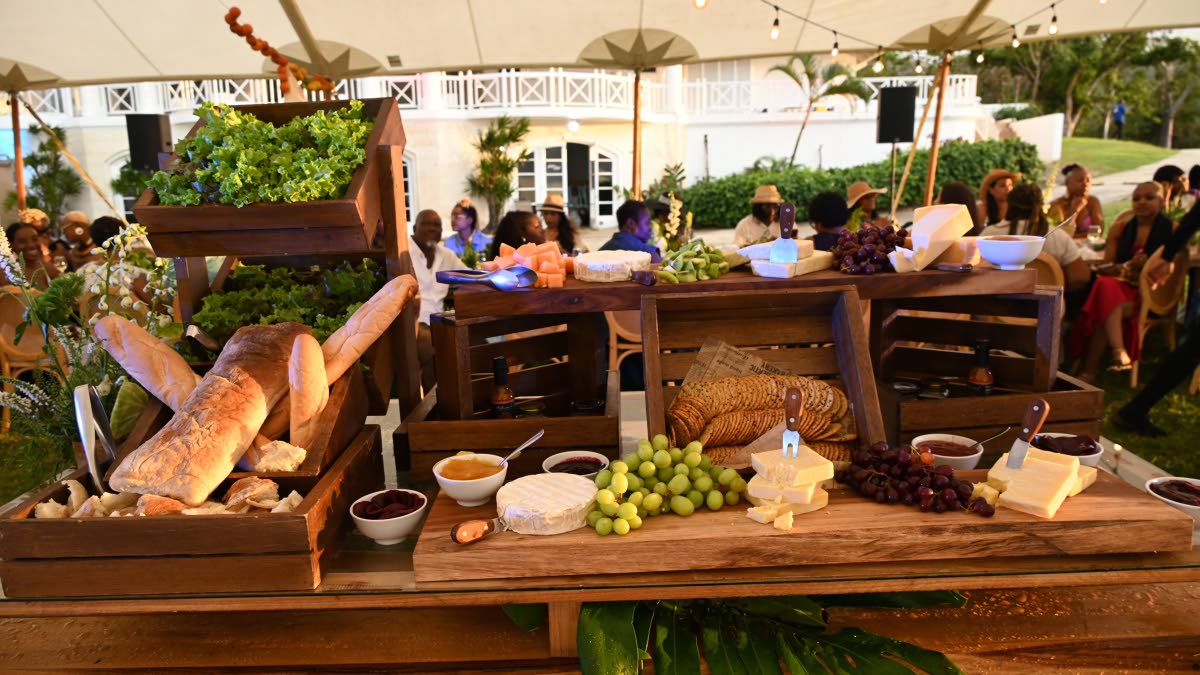 The main spread, an elevated charcuterie display featuring a variety of cheeses, crackers, fruits and breads, prepared by Chef Oji Jaja.