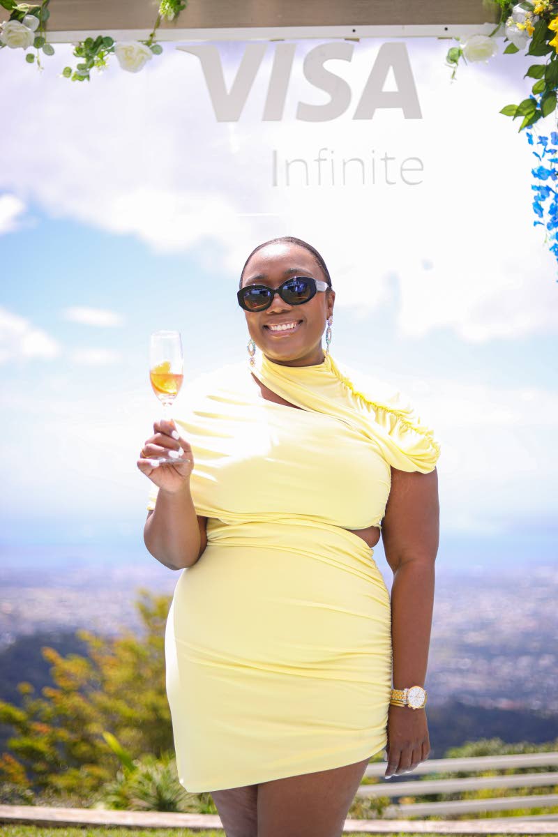 With a toast to a perfect festival crescendo, Gabrielle Hylton, marketing manager of the Jamaica Food and Drink Festival, is all smiles.