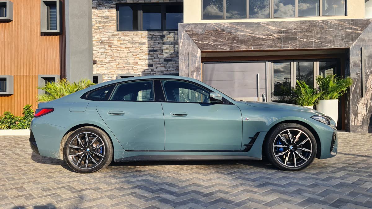 From the side profile, the 4 Series distinguishes itself with a low-slung silhouette and a dramatic roofline that flows seamlessly into the rear deck, emphasising its aerodynamic efficiency.