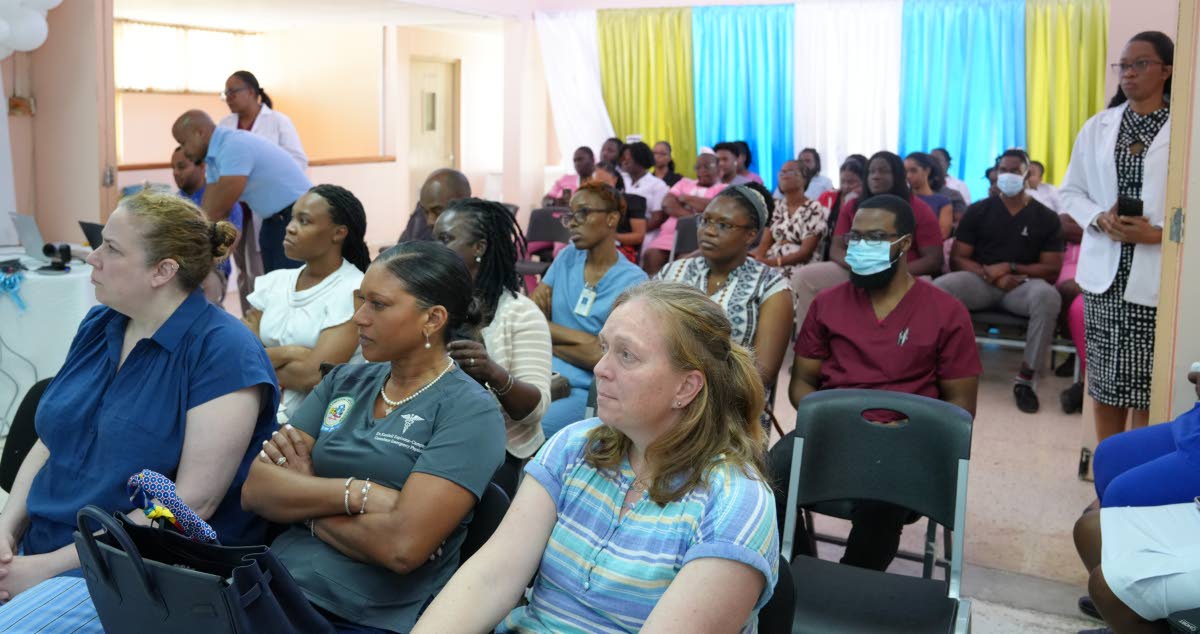 Doctors, nurses and medical students listen during the “Coordinated Care in Penetrative Cardiac Trauma” seminar at May Pen Hospital where the historic cardiac trauma case was presented on Thursday.