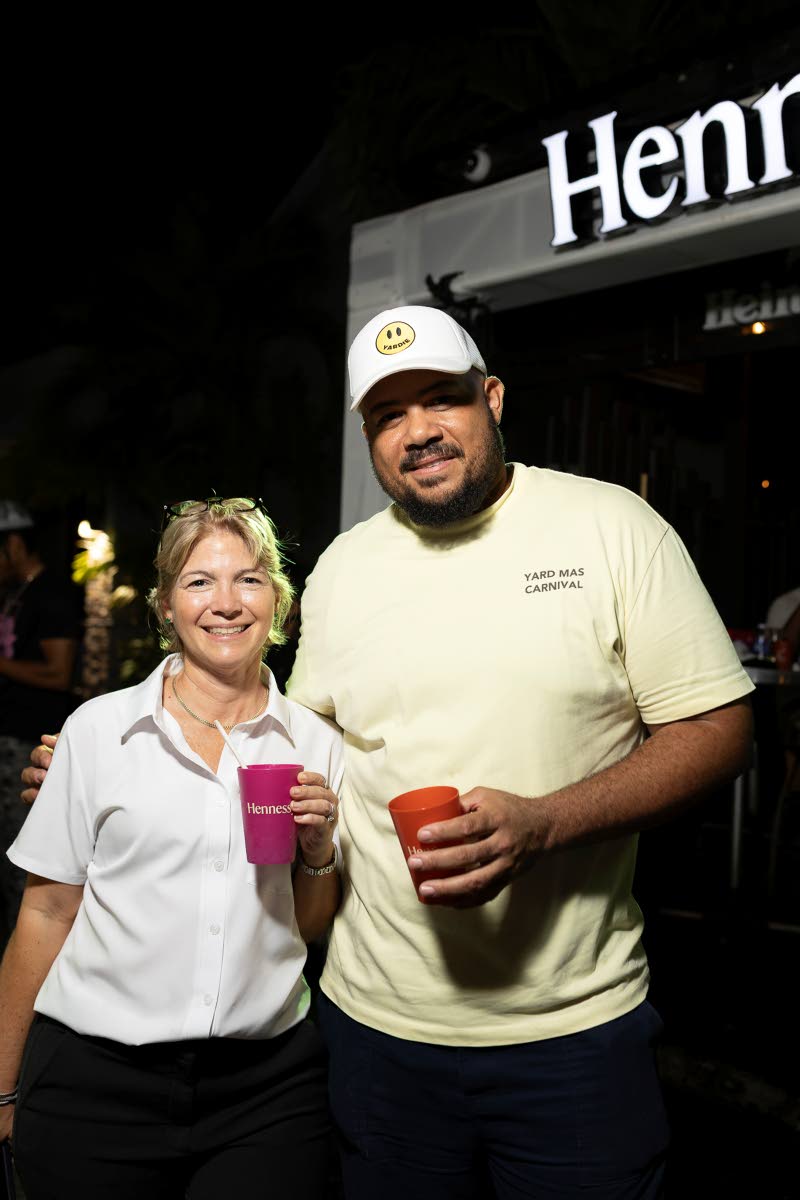 Tania McConnell (left), corporate marketing manager, Select Brands, and Yard Mas Managing Director Andrew Bellamy, pause for a snap at the Spirit of Carnival launch.