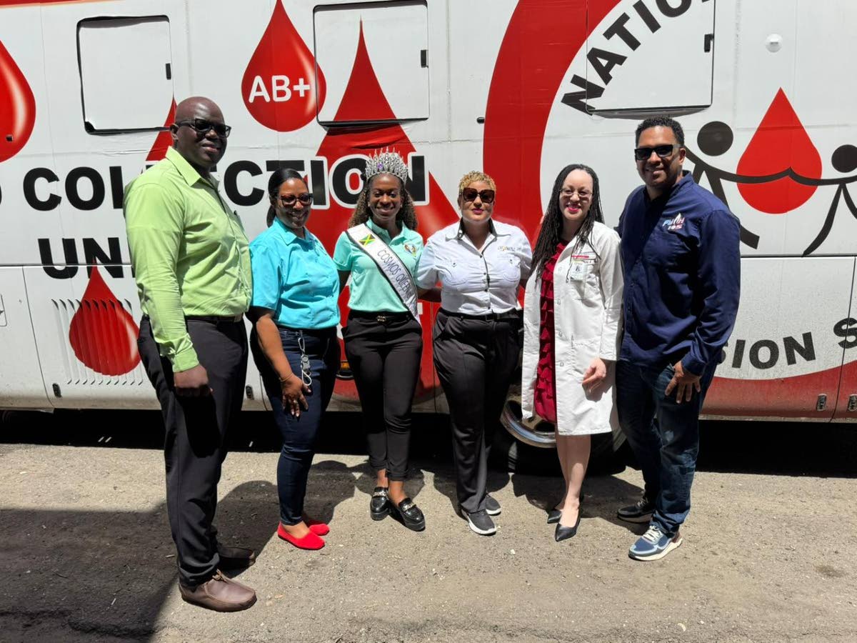State Minister in the Ministry of Health and Wellness, Krystal Lee (3rd right), shares a light moment at  the Mobile Blood Collection Unit during the World Kidney Week Health Fair and Blood Drive. Also sharing in the moment are (from left): Dwayne Francis,