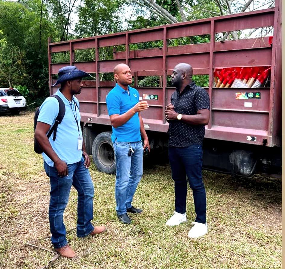 Rural Agricultural Development Authority (RADA) Parish Manager Kashief Smith (centre) makes a point to Christopher Brown (right), member of parliament for St Mary South Eastern, as RADA Extension Officer Kavil Howard (left) looks on.