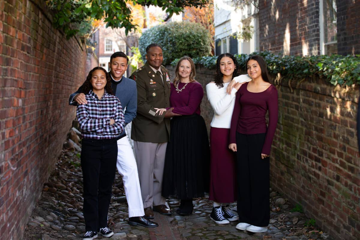 Col. Mark Denton (second left) and wife Teresa (third right) flanked by their children (from left) Haley, Zachary, Markey and Makayla. 