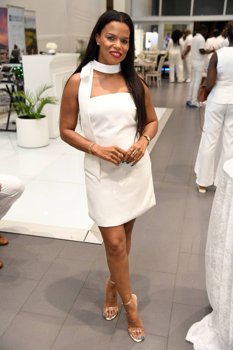 Sheryl Hines Evans, financial adviser, opts for a classic white mini, complemented by metallic heels.