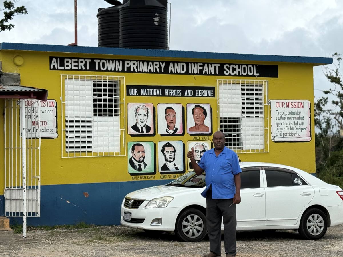 Godfrey Blake, principal of Albert Town Primary and Infant School, stands at the school’s entrance.