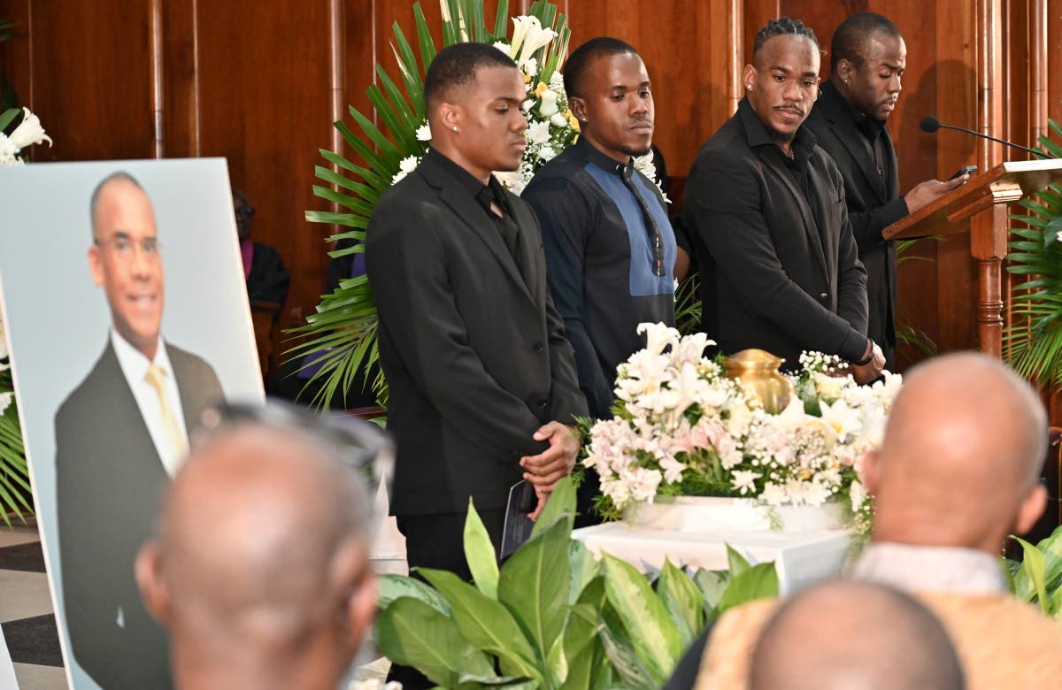 From left: Andrew Paul; Tabeal Paul; Jared Paul and Joshua Paul, sons of the late Dr Tomlin Paul, reading the eulogy during yesterday’s funeral.