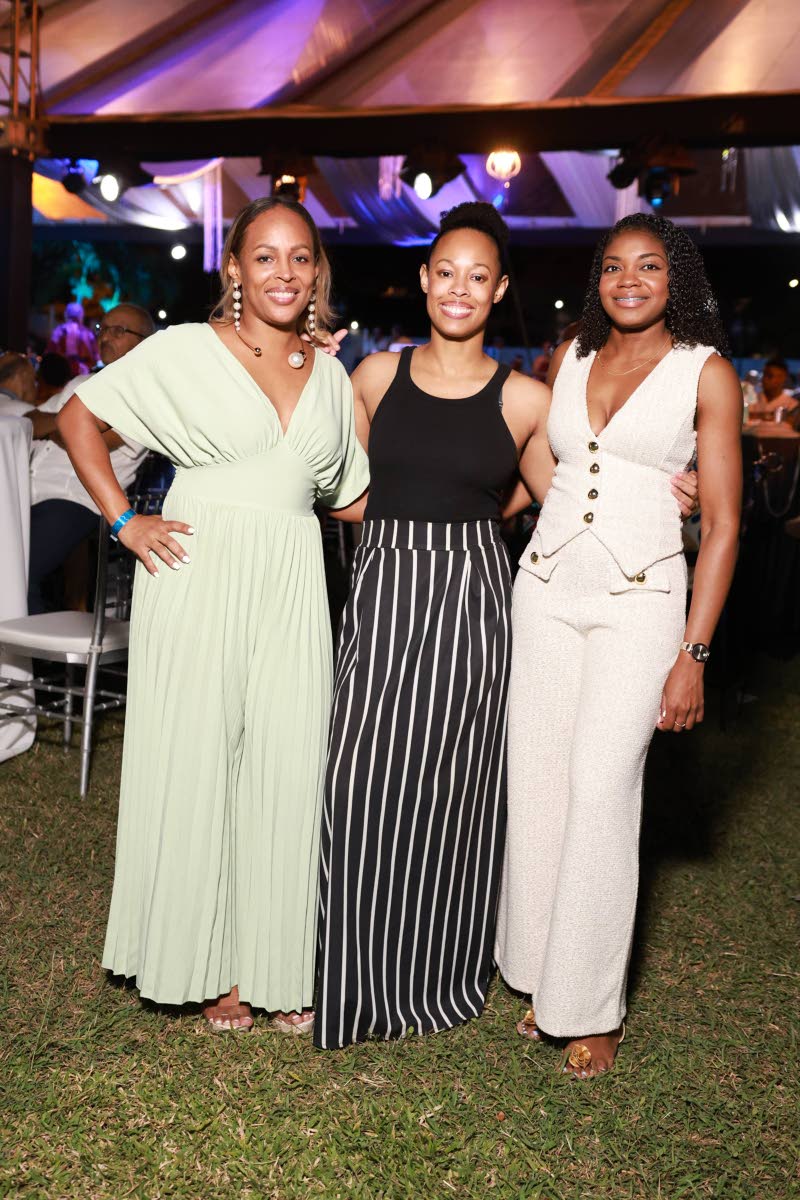 From left: Toni-Ann Neita-Elliott, vice-president of sales and marketing at Sterling Asset Management, and her sister Stephanie Koathes, pause for a quick photo with Shanique Williamson, manager, personal financial planning at Sterling Asset Management.