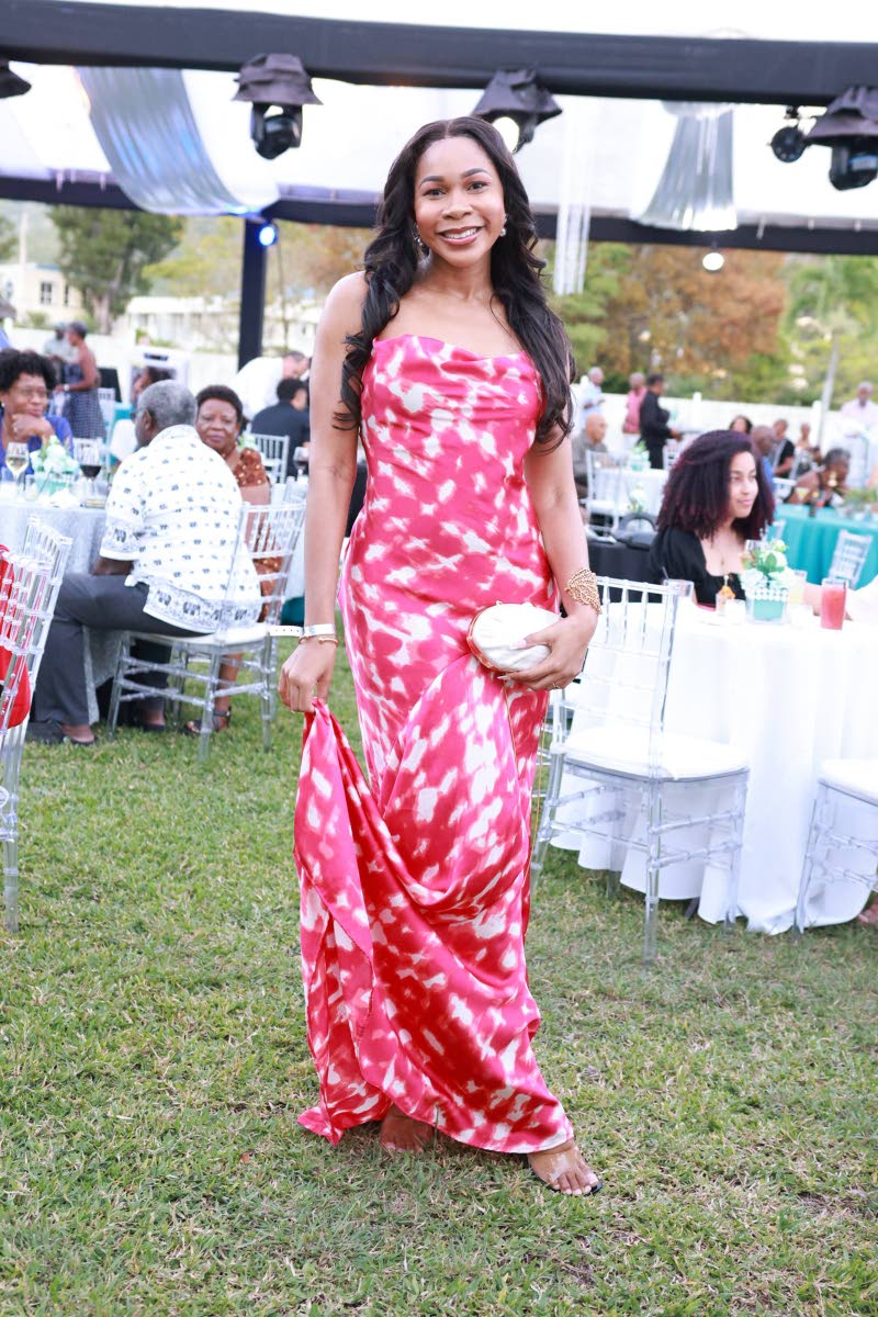 Joamie Tweed is a darling in her satin maxi dress.