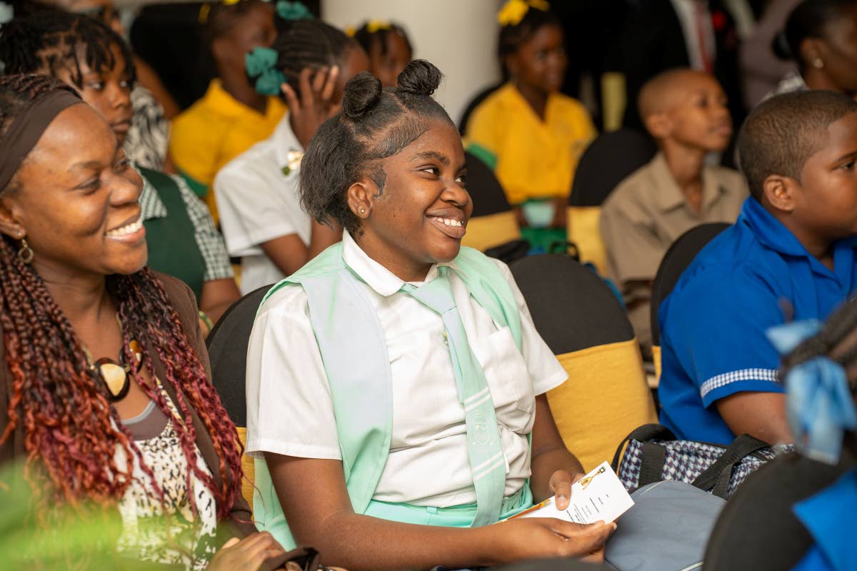 Student of the Lister Mair Gilby School for the Deaf, Dayanna Jackson, enjoys the recognition ceremony held on March 19 in Kingston for students who participated in the Sustainable Development Goals (SDG) Youth Creative Expression Competition organised by 