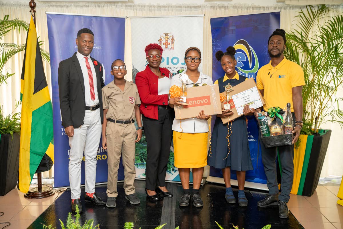 From left: Dwayne Cameron, art teacher at Campion College, with Bryce Wilson, winner of the lower‑secondary cover design challenge; Kate Smith Moulton of York Castle High School with upper‑secondary story winner Haley Clarke; and teacher Jason Richard 