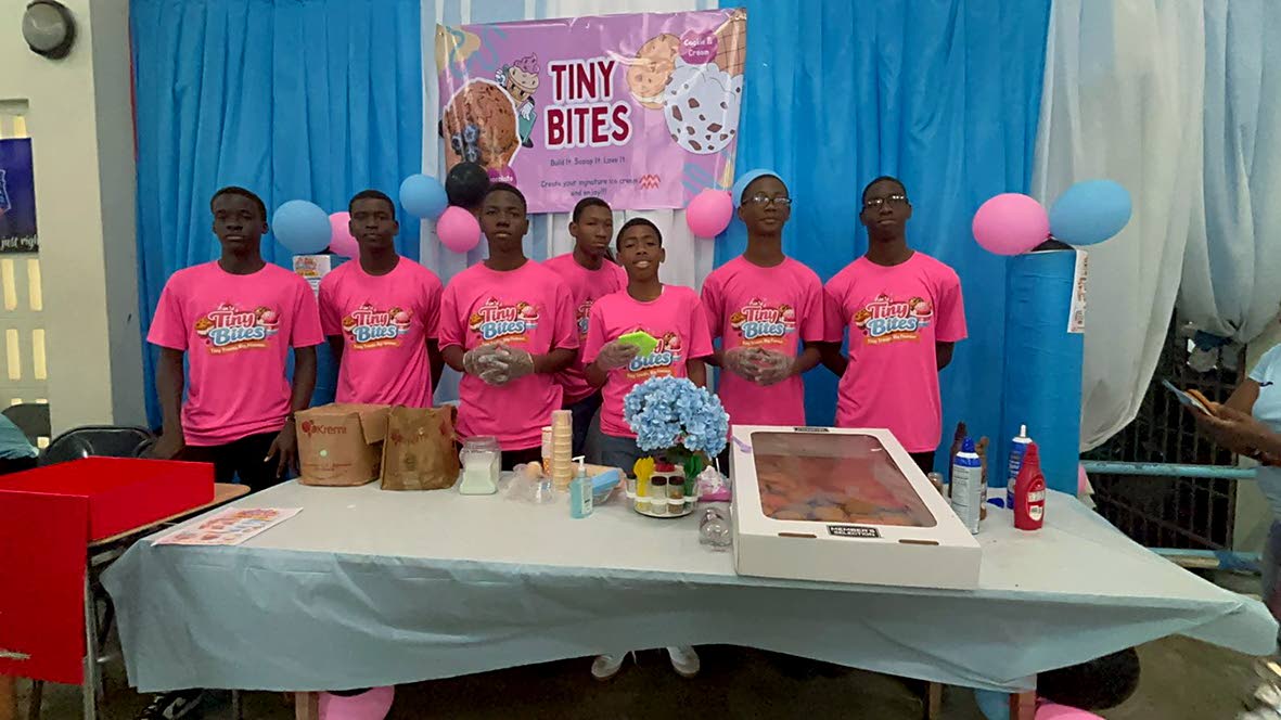 This group, operating the pastry business Tiny Bites, poses for a photo at their booth at the STGC Teen Biz Expo 2026.
