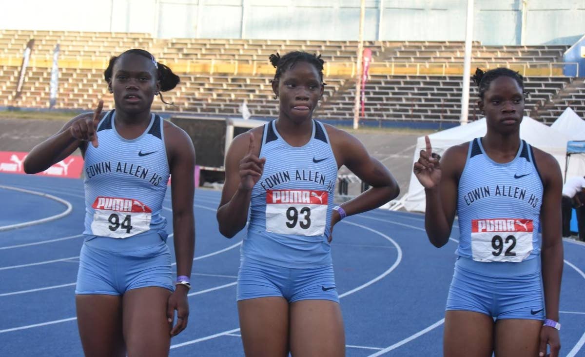 From left: Serena Cole and twins Tia and Tina Clayton of  Edwin Allen High at the National Stadium in 2022.