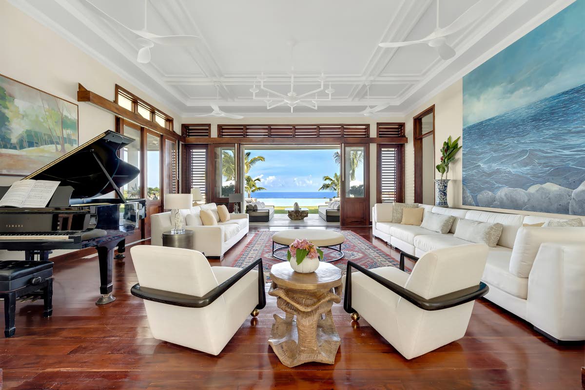 The main living room looks out to pool and sea views.