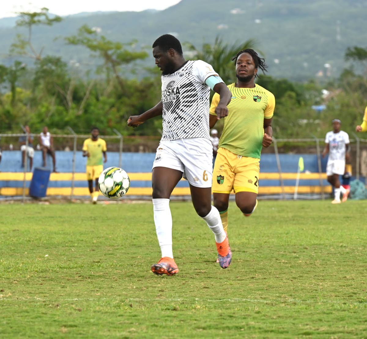 Cavalier SC’s Jeovani Laing (left) tries to keep the ball away from Treasure Beach FC’s Naqwan Henry during a Jamaica Premier League match at the St Elizabeth Sports Complex on March 15.